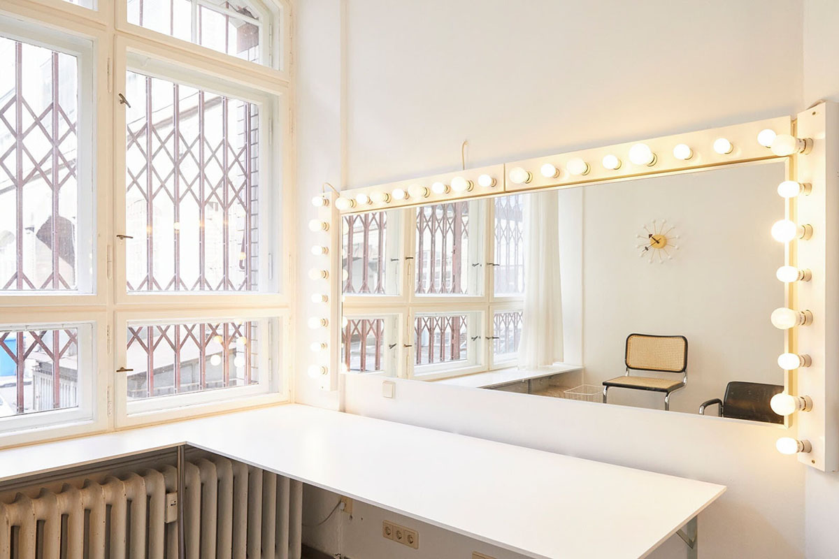 Make-up room with fully illuminated mirror